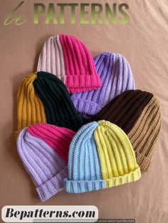 six knitted beanies in different colors on a brown background with the words be patterns below them