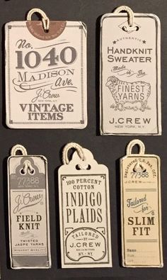 several tags are hanging on the wall with some type of labels attached to each one