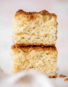 two pieces of coconut cake stacked on top of each other