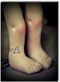 the legs and feet of a woman with pink socks