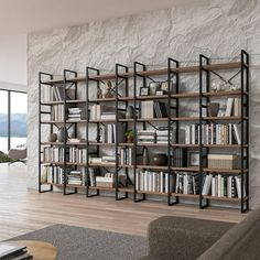 a living room filled with furniture and a book shelf next to a wall mounted tv