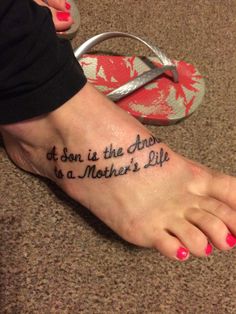 a woman's foot with a tattoo that reads, it son is the anchor to a mother's life