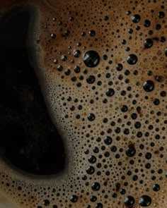 a close up view of the inside of a coffee cup with water droplets on it