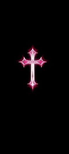 the cross is glowing in the dark with pink lights on it's sides,