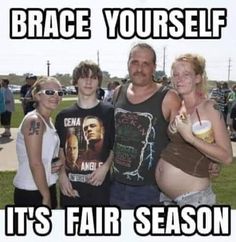 a group of people standing next to each other in front of a sign that says brace yourself it's fair season