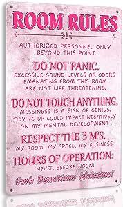 a pink sign that says room rules