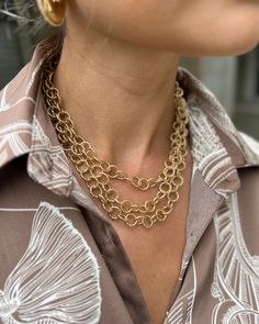 The delicate design features two layered circles, creating a unique and sophisticated aesthetic. Made of high-quality gold metal, this necklace is a timeless piece that will elevate any outfit. Lobster claw style clasp 3 Layers all connected