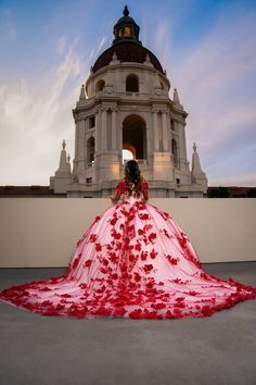 a woman in a red and white wedding dress