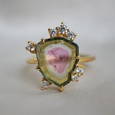 Handcrafted in 14K gold with natural sliced watermelon tourmaline #watermelontourmaline #engagementringsunique Interesting Engagement Rings, Watermelon Tourmaline Engagement Ring, Sliced Watermelon, Gemstone Rings Unique, Rock Ring, Watermelon Tourmaline Ring, Tourmaline Jewelry, Funky Jewelry, Jewelry Lookbook