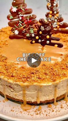 a cheesecake covered in caramel sauce and decorated with chocolate christmas trees on top