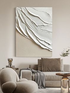 a living room filled with furniture and a painting on the wall