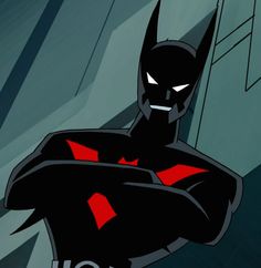 the batman animated character is standing in front of a wall