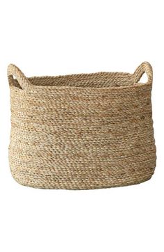 a large round basket with handles on the top and bottom, made out of jute