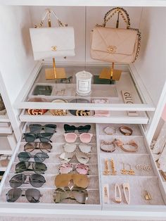 the inside of a closet filled with sunglasses and purses