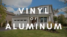 a house with the words vinyl or aluminum on it in front of some grass and trees