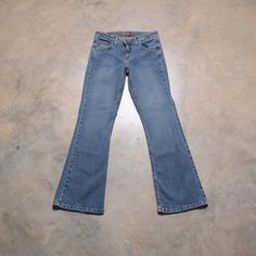 You are looking at a classic pair of vintage 90s/00s LEI bootcut flare jeans. Excellent vintage condition. Labeled as a size 9. Please see actual measurements below.  Waist: 30" Rise: 9" Hips: 35" Bottom opening: 19" Inseam: 31" Outseam: 39.5" If you would like to see additional photos or have any other questions, please do not hesitate to ask, and thanks for looking! Shipping disclaimer: All domestic orders under 16oz ship USPS Ground Advantage. All domestic orders over 16oz ship USPS priority Y2k Stretch Flare Jeans Full Length, Y2k Stretch Flare Jeans, Y2k Fitted Wide Leg Flare Jeans, Fitted Wide Leg Y2k Flare Jeans, 90s Mid-rise Stretch Jeans, 90s Stretch Mid-rise Jeans, 90s Style Stretch Mid-rise Jeans, Y2k Medium Wash Fitted Flare Jeans, Medium Wash Fitted Flare Jeans Y2k Style