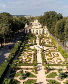 an aerial view of a garden in the middle of a park