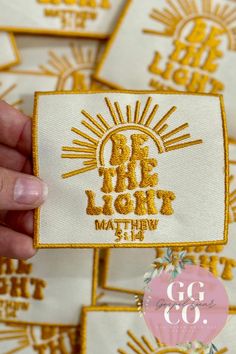 someone is holding up a patch with the words, be bright within and go co on it