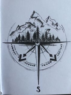 a drawing of a compass with trees and mountains in the background, on top of a piece of paper