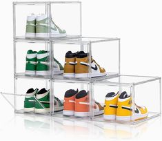 four tiered clear acrylic shoe rack with multiple pairs of shoes in them