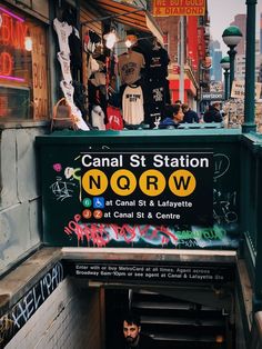 there is a sign that says canal st station nobw in front of it