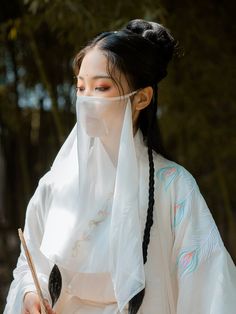 Add a touch of mystery and drama to any hanfu ensemble with these simple veils. Traditionally worn on long journeys, special events, and just for fun! Choose from a variety of colors to best suit your style. Perfect for layering over surgical masks while adding a fantastical touch ~ Material: polyester chiffon Size: 40*60cm About the brand: 绛尾儿 绛尾儿, or Jiang Yi'er is the leading hanfu accessory store for veils and stunning beaded belts. Creating gorgeous accessories for every dynasty, they offer White Hair Color Ideas, Mask Design Ideas, Rose Character, Veil Mask, Ancient Chinese Hairstyles, Hanfu Accessories, Beaded Belts, Gesture Drawing Poses, Simple Veil