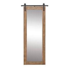 a wooden door with a mirror hanging on the front and back side, against a white background