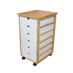 a wooden and white drawer on wheels with drawers in the bottom half, one side is open