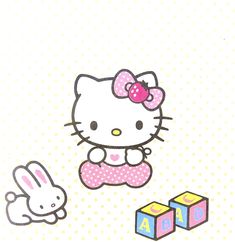 an image of hello kitty playing with blocks