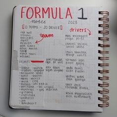 a spiral notebook with the words formula written in red and black on it, next to a cup of coffee