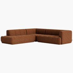 a brown couch sitting on top of a white floor