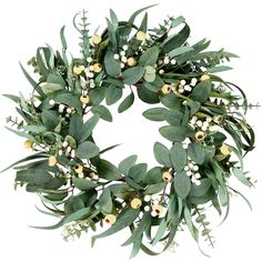 a wreath with green leaves and white berries