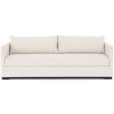 a white couch with two pillows on it