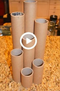 several rolls of toilet paper stacked on top of each other in front of a counter