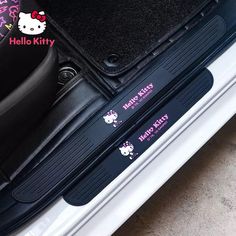 hello kitty stickers on the trunk of a car