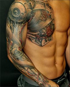 a man with tattoos on his arm and chest