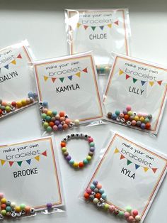 four bags of personalized bracelets with name tags on them for kids to use