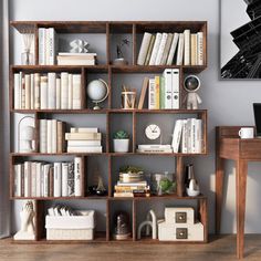 a bookshelf filled with lots of books next to a desk