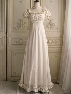 Immerse yourself in the elegance of the Regency era with this exquisite cream Bridgerton-inspired dress. Perfect for brides and special occasions, this gown combines vintage charm with luxurious details, making it a timeless addition to your wardrobe. Elegant Design: Featuring a classic Regency silhouette, this dress b Regency Era Nightgown, Regency Nightgown, Regency Silhouette, Regency Era Dress, Regency Dresses, Nontraditional Wedding Dress, Wedding Dresses High Low, Floral Applique Dress, Bridgerton Inspired