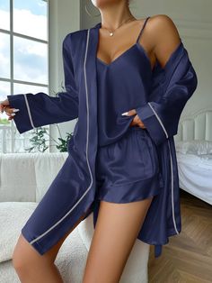 Get ready to elevate your bedtime routine with our luxurious Women's Silk Satin Pajama Set, the epitome of chic comfort! 💫 Indulge in pure elegance as you slip into this ensemble crafted for ultimate relaxation and style. The set includes a sophisticated long-sleeve belted robe, a charming V-neck cami top, and matching shorts, all made from smooth satin fabric that feels like a dream against your skin. Whether you're unwinding after a long day or getting ready to drift off into dreamland, this Silk Cami Pajama Set, Night Pyjamas, Silky Pyjamas, Classy Pjs, Silk Pajama, Silk Pyjama Set, Silk Pajamas Aesthetic, Silk Pyjamas, Night Wear For Women Sleep