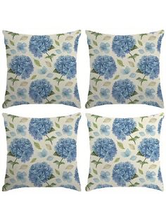 four pillows with blue flowers on them