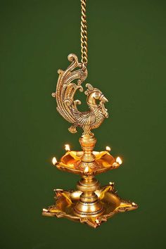 a gold colored chandelier hanging from a chain