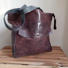 Aubergine large leather bag for women. Leather with a light texture, shaded. This is a natural nubuck leather. Handles navy blue. On the backe exterior zip pocket. Large outside pocket on the front. The bag is closed with a zipper. Zippered, inside lining,and zip pocket and 2 on phones. The bottom of the double leather. Big :) Height of 30 cm, the overall width of 46 cm at the top. Handles 55 cm. I send all bags by UPS courier. The bag goes to the USA about 7 days, in Europe it takes about 5 day Purple Leather Satchel, Soft Leather Purple Shoulder Bag, Purple Soft Leather Shoulder Bag, Purple Leather Tote Shoulder Bag, Purple Leather Shoulder Bag For Everyday, Everyday Purple Leather Shoulder Bag, Purple Soft Leather Bag, Purple Leather Hobo Tote Bag, Purple Leather Rectangular Hobo Bag