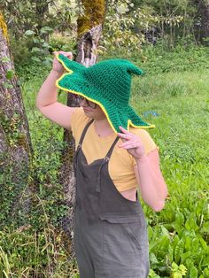 A person is wearing a crocheted green, slouchy witch hat with a star shaped brim. The brim is gold. They have their head tilted down and hands  holding the brim to show the hat off Crochet Star Hat, Loom Crochet, Big Twist, Floral Wire, Witch Hat, Easy Projects, Book Crafts, Hat Pattern, Crochet Clothes