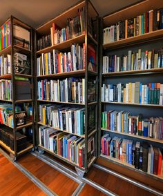 a room filled with lots of books on shelves