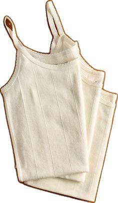 Beige Ribbed Cotton Tank Top, Comfortable Seamless Cotton Tops, Ribbed Cami Camisole, Stretch Cotton Camisole With Seamless Construction, Beige Cotton Tank Top With Spaghetti Straps, Beige Cotton Spaghetti Strap Tank Top, Seamless Cotton Camisole, Seamless Cotton Cami Tank Top, Cotton Spaghetti Strap Tank Top For Layering