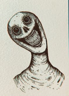 a drawing of an alien head with two eyes