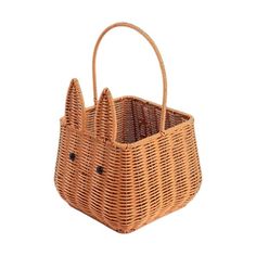 a wicker bag with two ears on it