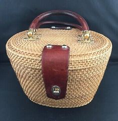 an old wicker basket with leather handles