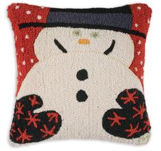 a pillow with a snowman on it